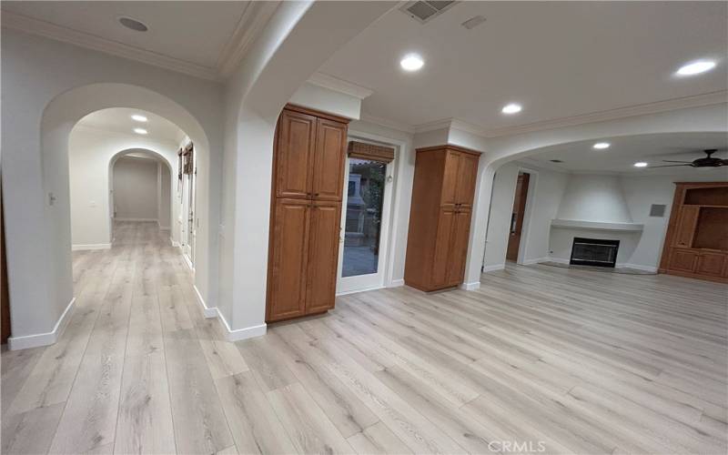 Kitchen, nook, entrance to courtyard, and family room