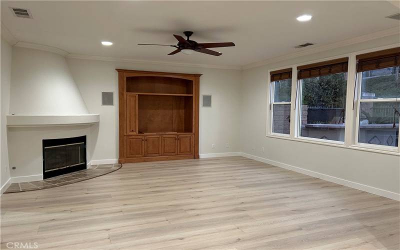 Family Room with built in cabinets and four in wall surround sound speakers.