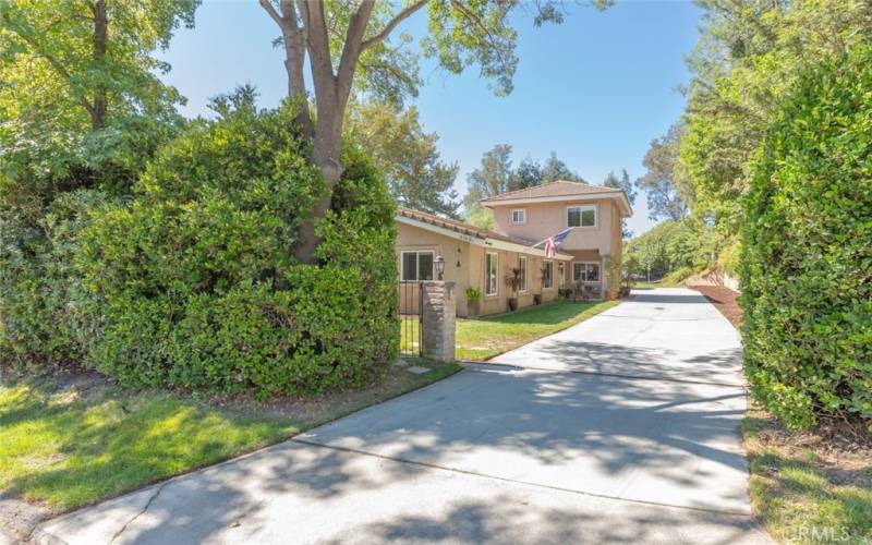 Long flat driveway for plenty of parking. Has Electronic gate.