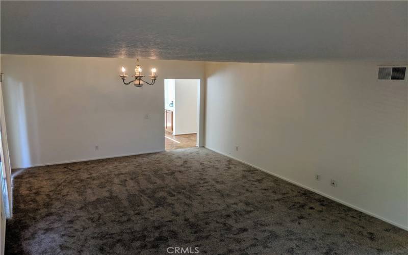 Living room and formal dining room looking towards kitchen