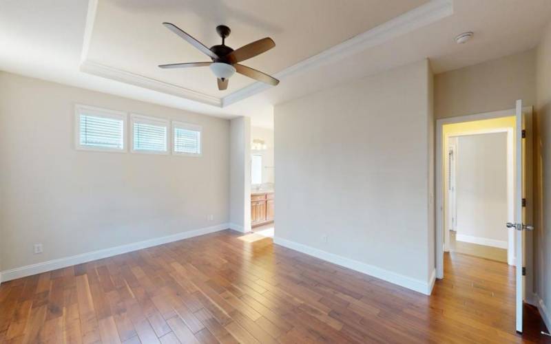 Primary bedroom with coffered ceiling