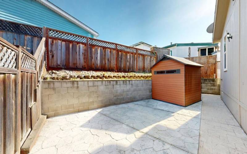 Private low maintenance yard with shed