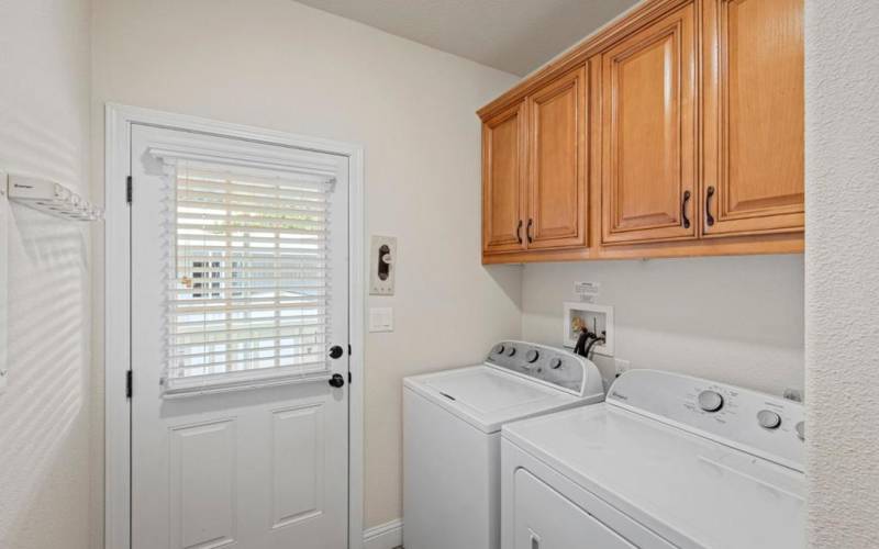 laundry room with exterior access to carport