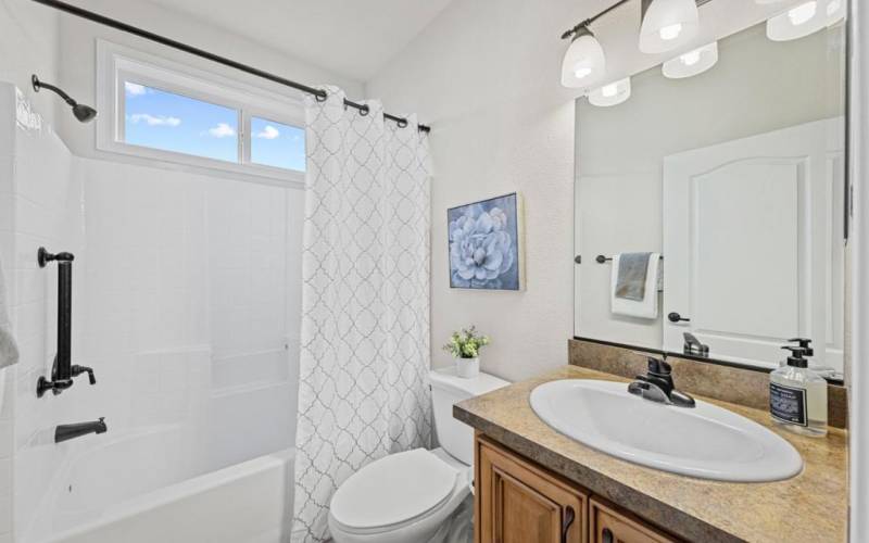 Guest / Hall bath; shower over tub