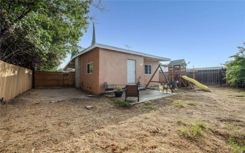 Spacious, Newly Fenced Backyard, Patio Area, Jungle Gym (included) and Fruit Trees