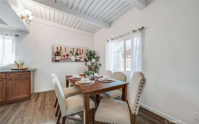 Darling Dining Area with lots of light and Beamed Ceilings