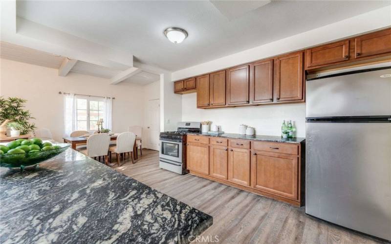 Beautifully Updated, Open Concept Kitchen/Dining with Stainless Steel Appliances (all included), Granite Countertops, Modern Euro-Style Cabinets