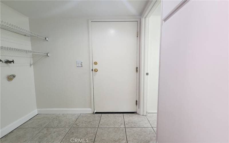 Laundry Room with Direct Garage Access and Half Bath