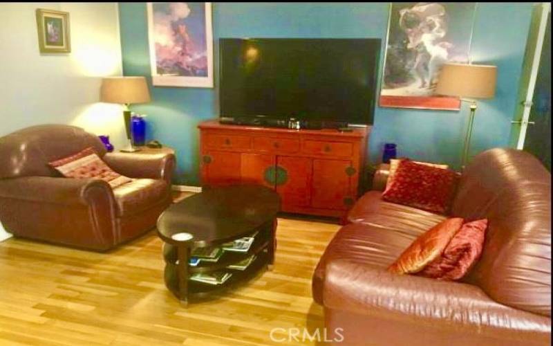 Living room with comfortable couches & 55 inch TV