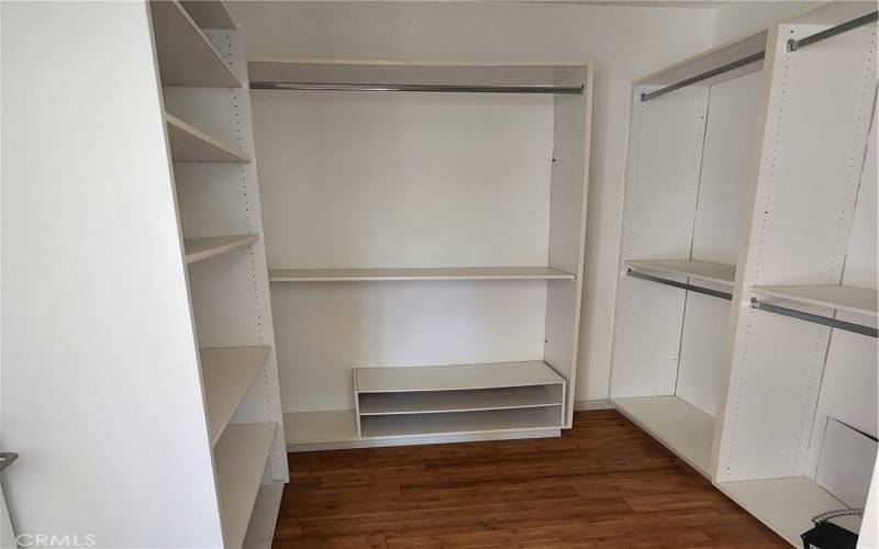 Primary bedroom walk-in closet