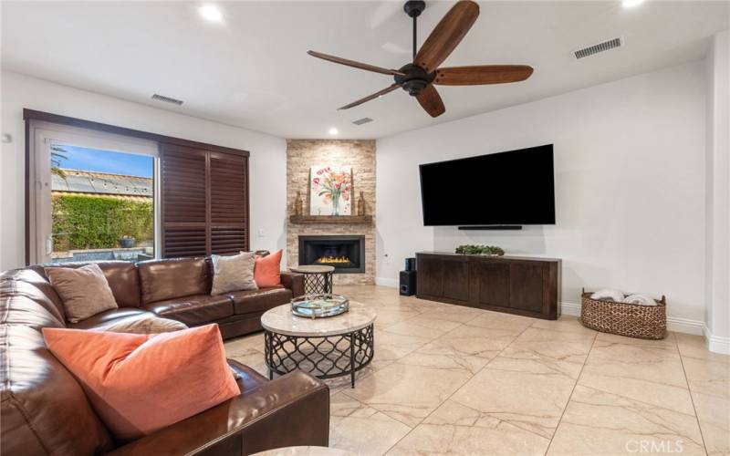 Living room has a great fireplace and includes the TV.