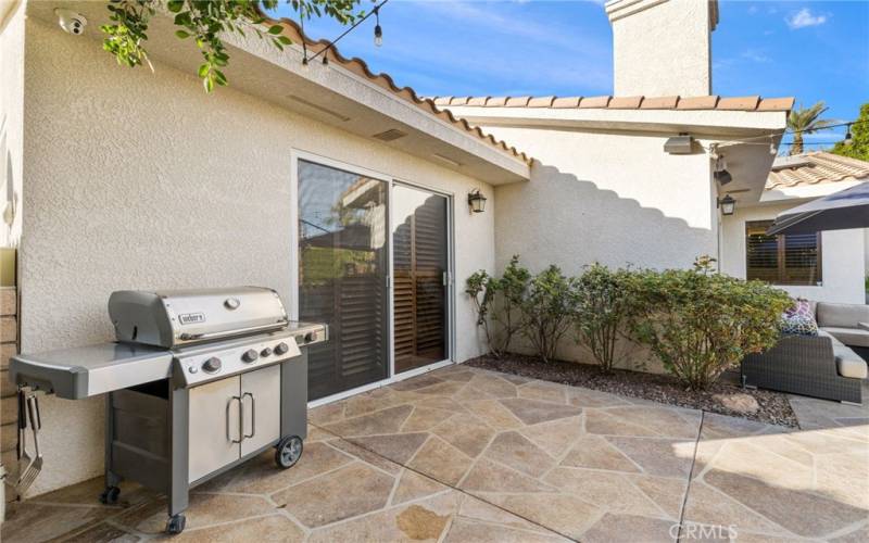 Grill included within the backyard.