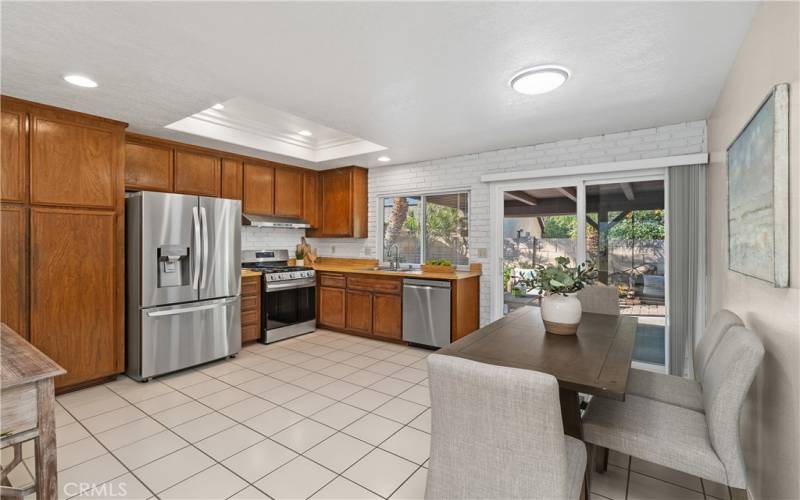 Spacious kitchen opening to outdoor living space.