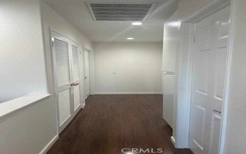 Upstairs hallway. Bedrooms and laundry closet are on either side