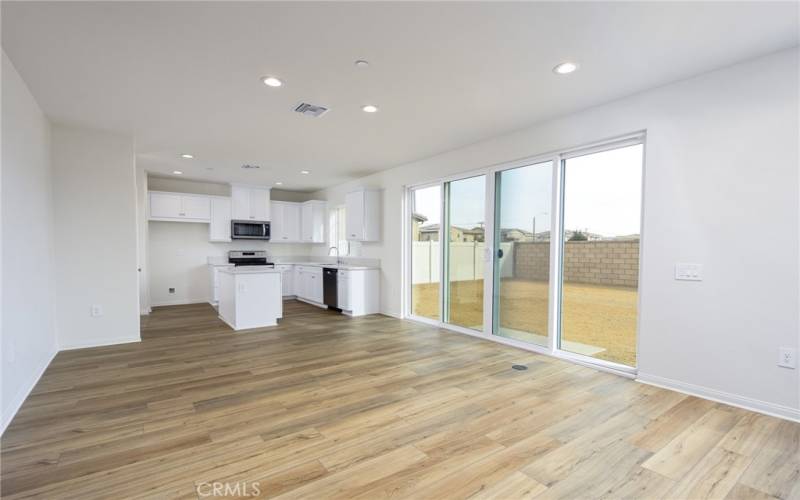 open floor plan featuring upgraded sliding doors