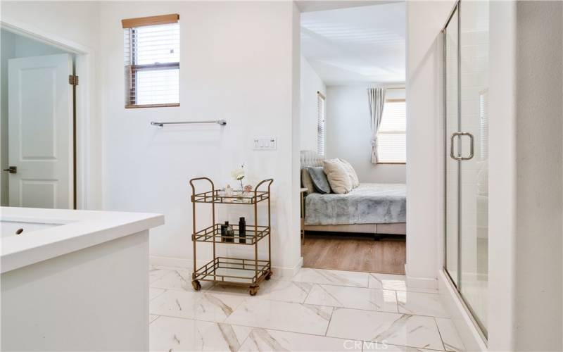 En-suite primary bath off primary bedroom. Upgraded tile & plenty of space