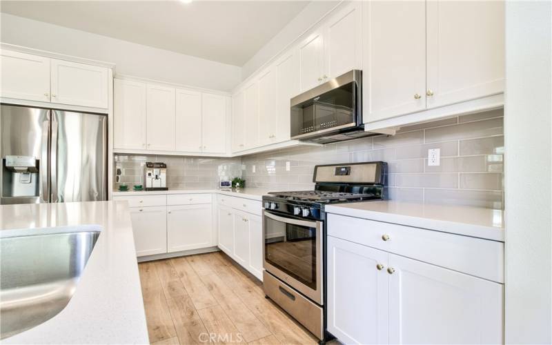 So much counter & cabinet space!  Bright & open