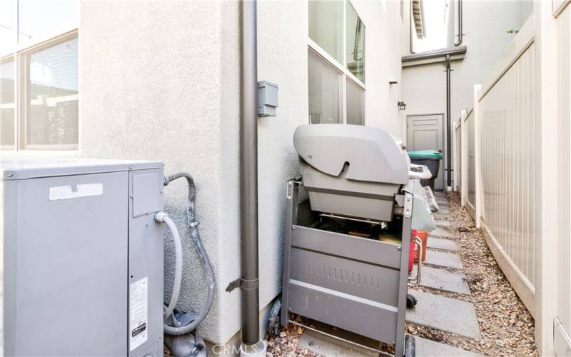 Home is only paired at garage. Side yard with door leading to garage.  Space for planting, bbq, etc.