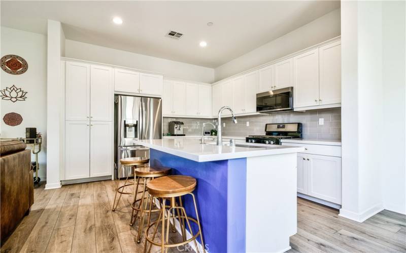 Large kitchen with upgraded stainless steel appliances, recessed lighting & plenty of space