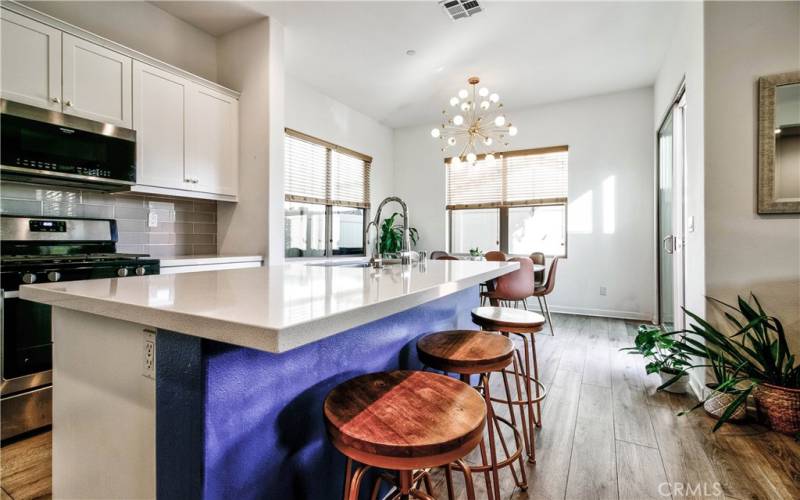 HUGE kitchen island overlooks both living & dining area