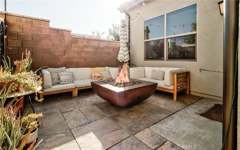 Back yard/patio looking towards living room windows