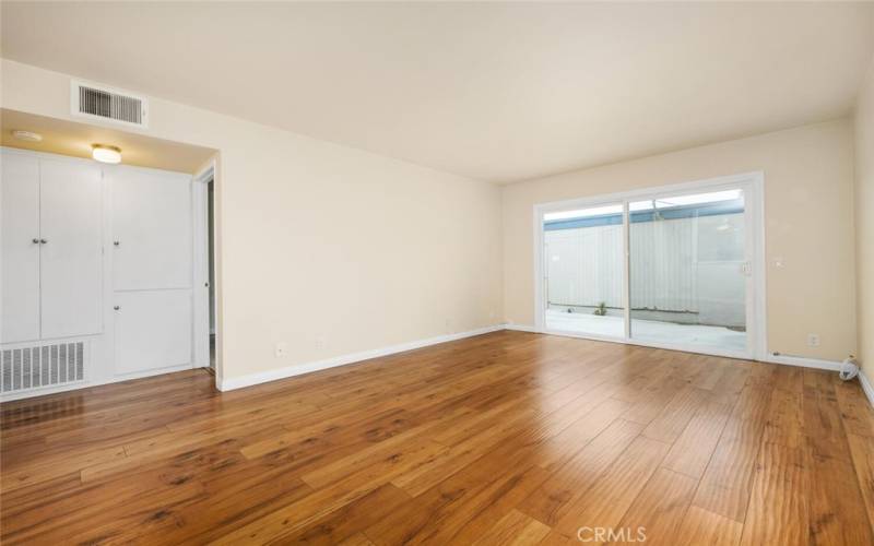 Living room opens up to patio and garage access.