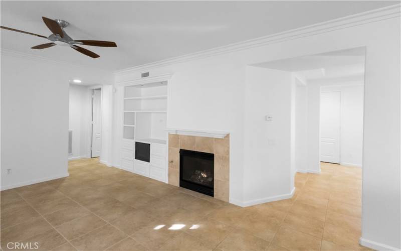 Large family room area with media niche and fireplace