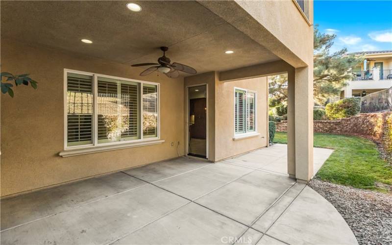 Large covered patio that opens up to the huge grassy yard maintained by HOA