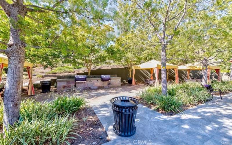 Barbecue area with lovely trees and tables