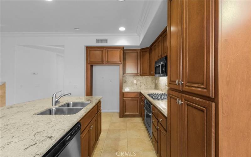 Stainless steel appliances and a large island is perfect for extra seating