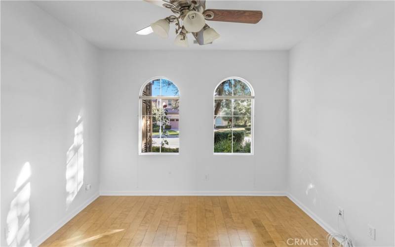 Front bedroom has lovely arched windows and ceiling fan