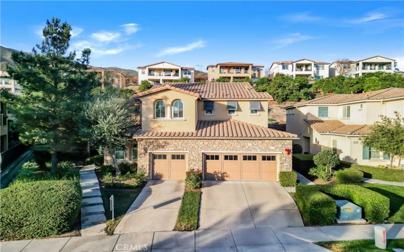 Welcome home! Use the steps on the left of the driveway to arrive at your front door.