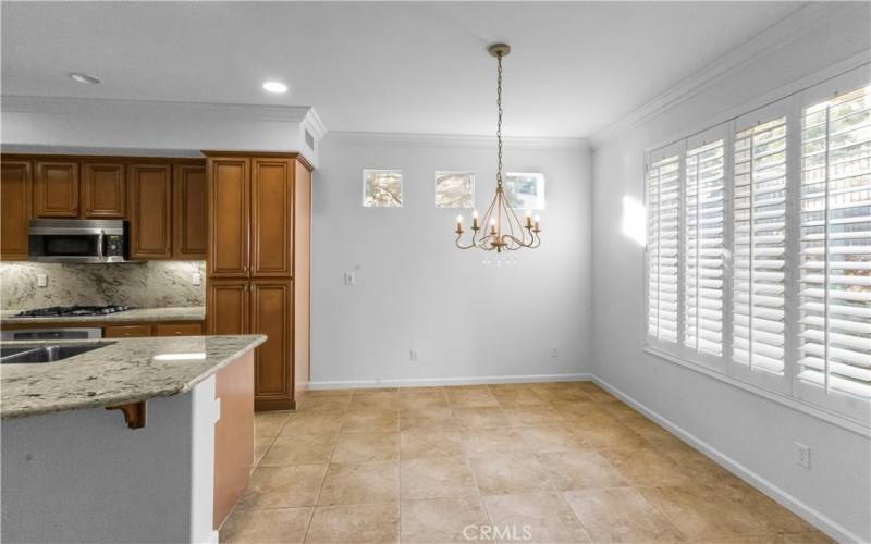 Large dining space with windows looking out into the backyard