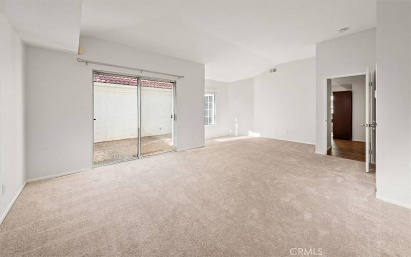 Primary bedroom with slider to atrium