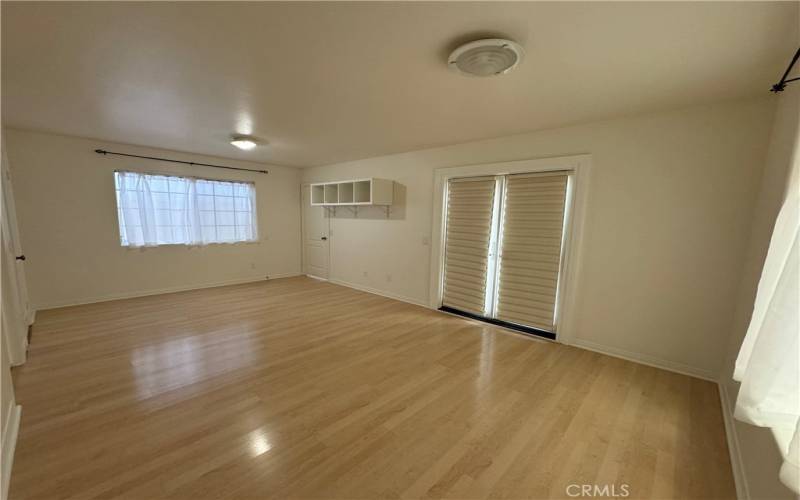 Additional room can be used as family den or office leads to backyard.