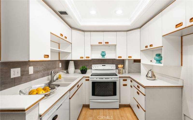 White solid surface counters make clean-up a breeze.