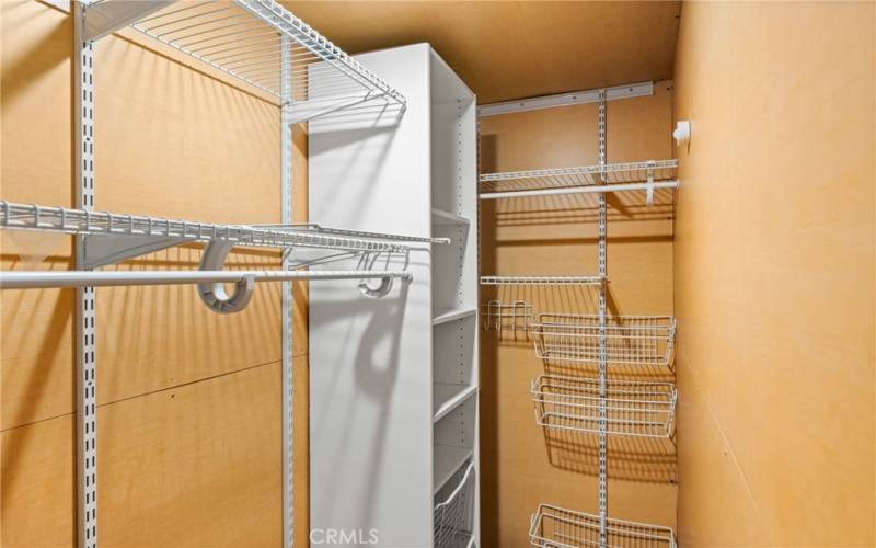 Large walk-in closet offers ample room.