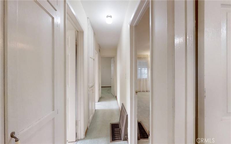 Hallway has an astonishing amount of cabinet storage.