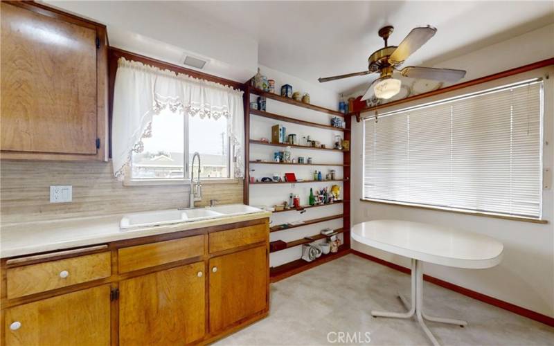 Dining area in kitchen with built in shelves