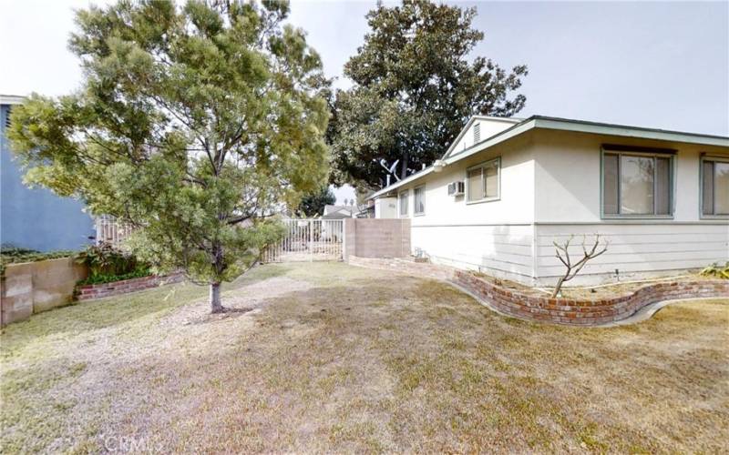 Front side yard with access gate