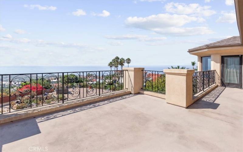 Generous sized upstairs balcony with city and ocean views.