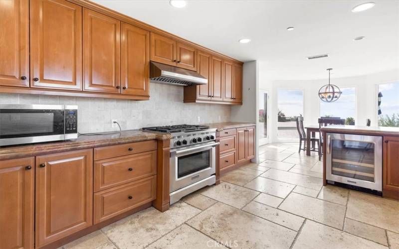 Custom cabinets, recessed lights, and a great open kitchen / dining concept.