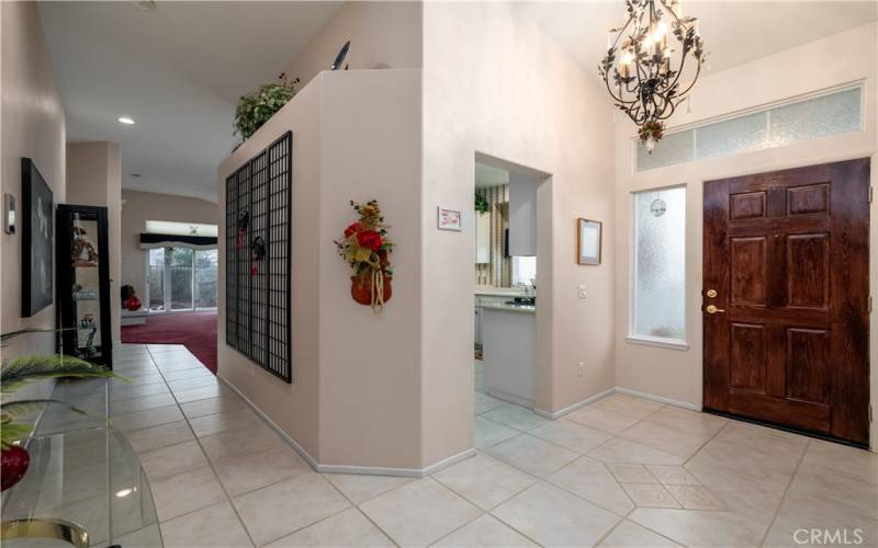 Entry way and hall way to primary bedroom and living room