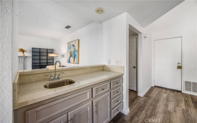 Nice wet bar provides extra storage & service space bewteen kitchen & family room.