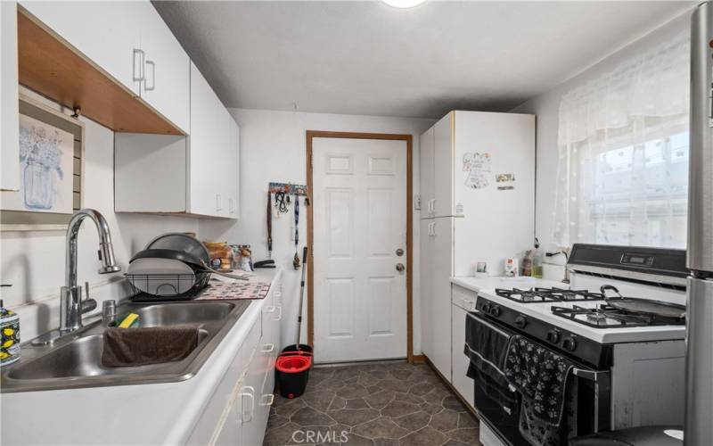 Front unit kitchen with back door entrance