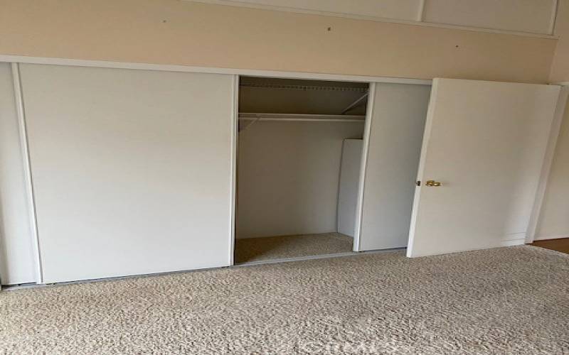 Closet and upper storage in front bedroom