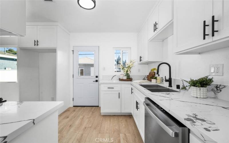 New Kitchen Cabinets, New Quartz Counter tops, New Sink, New Fixtures, New Dishwasher and New Flooring.