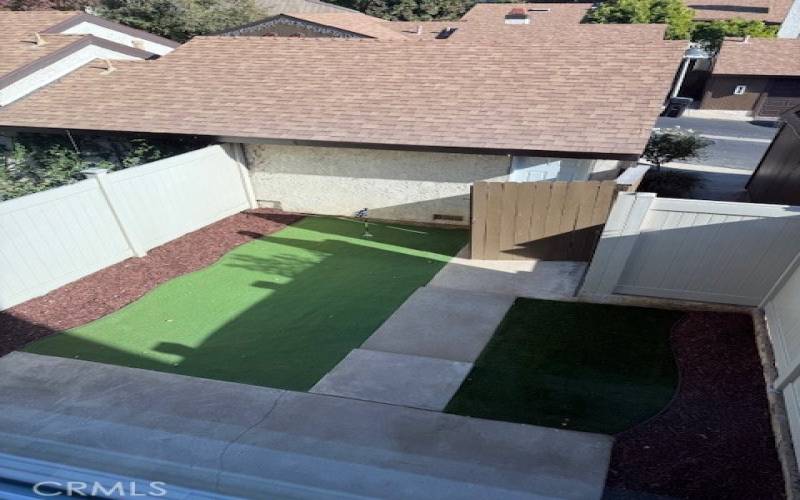 Detached garage and backyard with new turf putting green