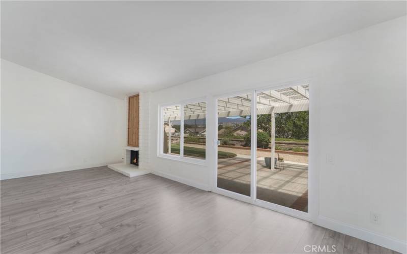 Living room with fireplace and access to the yard