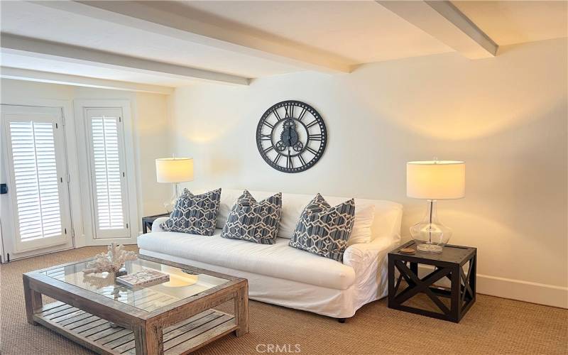 Bright family room next to kitchen.